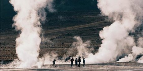 Plumes of steam rise from the ground on the El Tatio geyser field.
Plumes of steam rise from the ground on the El Tatio geyser field.
