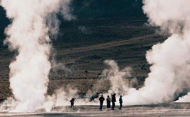 Plumes of steam rise from the ground on the El Tatio geyser field.
Plumes of steam rise from the ground on the El Tatio geyser field.