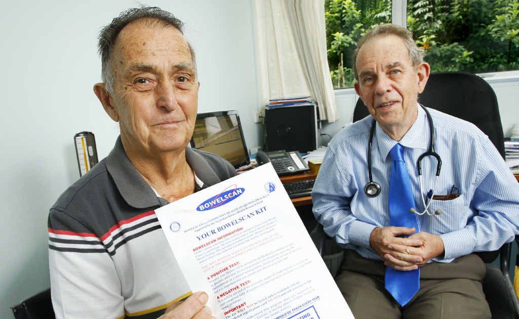 Bowel cancer survivor Ray Parcell shows a Bowelscan kit as Dr Cec Doughty of East Clinic looks on with approval. Bowel cancer survivor Ray Parcell shows a Bowelscan kit as Dr Cec Doughty of East Clinic looks on with approval.