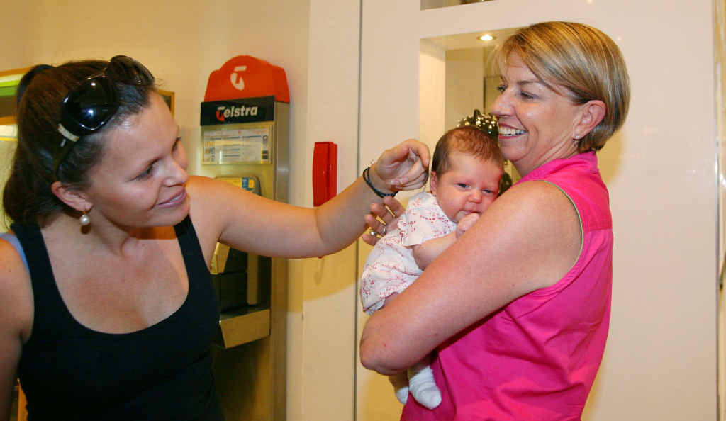 Premier Anna Bligh gets to grips with Zali Dooley in Stockland as Zali’s mum preens the bub. Premier Anna Bligh gets to grips with Zali Dooley in Stockland as Zali’s mum preens the bub.