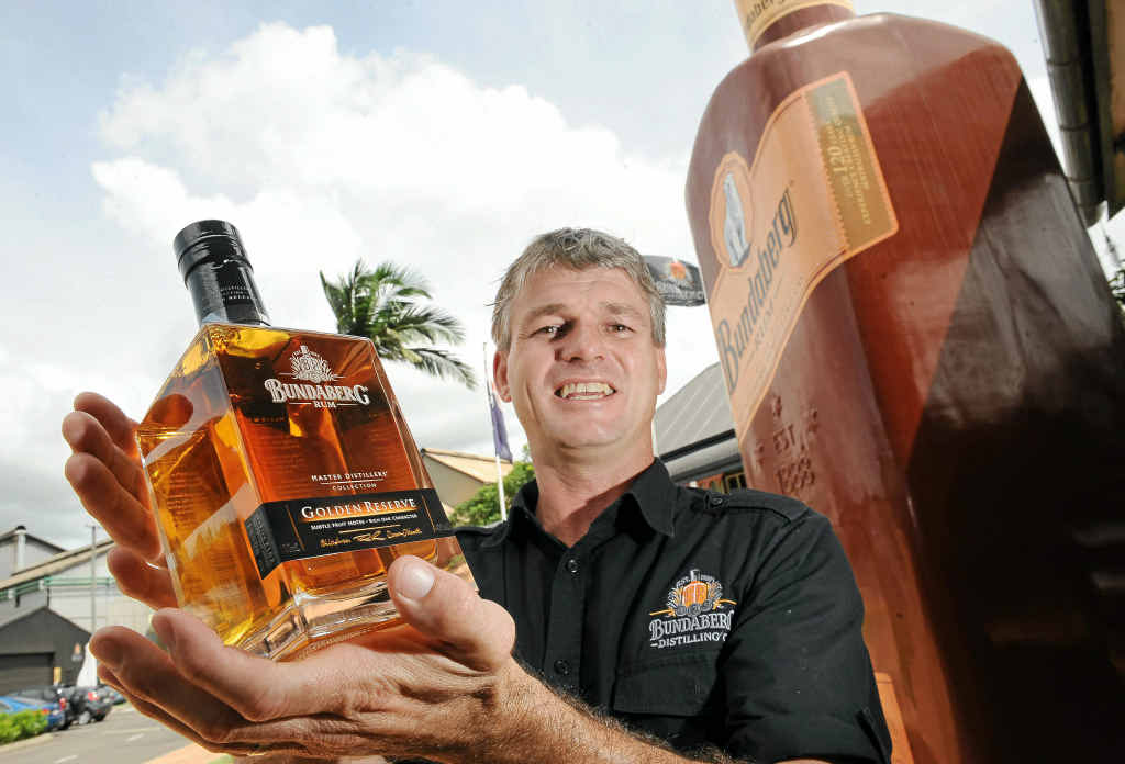 Bundaberg rum bond store manager Hayden Jobson with the latest bottle of rum. Bundaberg rum bond store manager Hayden Jobson with the latest bottle of rum.