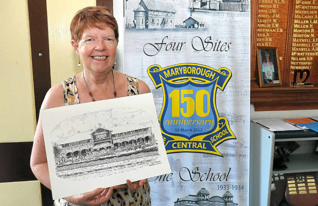 Maryborough Central State School teacher Janet Olds shows off a drawing of the original school building.