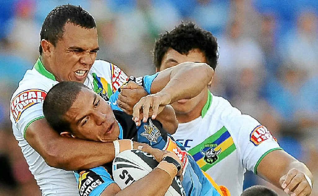 Gold Coast’s David Mead is gang-tackled by Raiders opponents on Saturday. Gold Coast’s David Mead is gang-tackled by Raiders opponents on Saturday.
