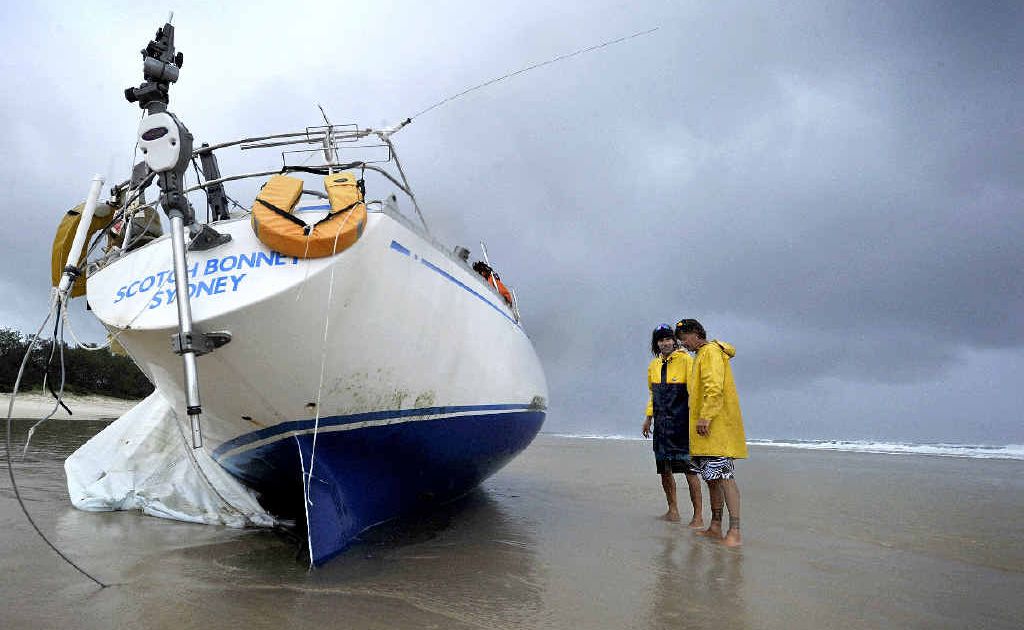 Brunswick Heads locals Ashley Virgo, left, and Colin James, survey the condition of the Scotch Bonnet washed up on Brunswick Heads Main Beach, believed to be an abandoned yacht from New Zealand. Photo Cathy Adams / The Northern Star Brunswick Heads locals Ashley Virgo, left, and Colin James, survey the condition of the Scotch Bonnet washed up on Brunswick Heads Main Beach, believed to be an abandoned yacht from New Zealand. Photo Cathy Adams / The Northern Star