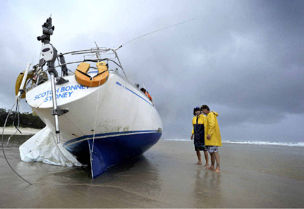 Brunswick Heads locals Ashley Virgo, left, and Colin James, survey the condition of the Scotch Bonnet washed up on Brunswick Heads Main Beach, believed to be an abandoned yacht from New Zealand. Photo Cathy Adams / The Northern Star Brunswick Heads locals Ashley Virgo, left, and Colin James, survey the condition of the Scotch Bonnet washed up on Brunswick Heads Main Beach, believed to be an abandoned yacht from New Zealand. Photo Cathy Adams / The Northern Star