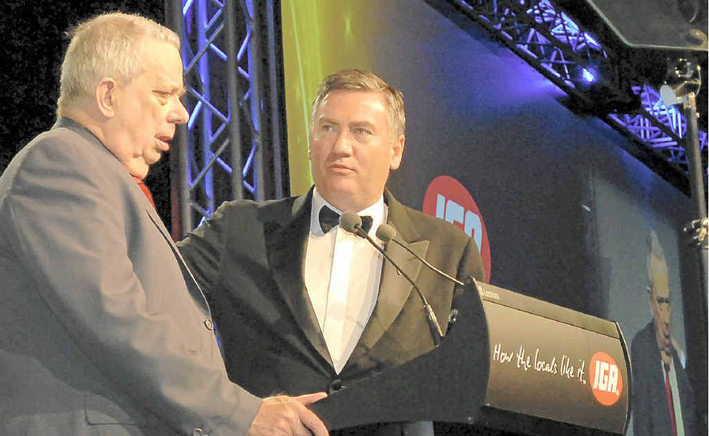 Derek Cornett receives his Retailer of the Year award from Eddie McGuire in 2010. Mr Cornett has been in the retail business for 68 years. Derek Cornett receives his Retailer of the Year award from Eddie McGuire in 2010. Mr Cornett has been in the retail business for 68 years.