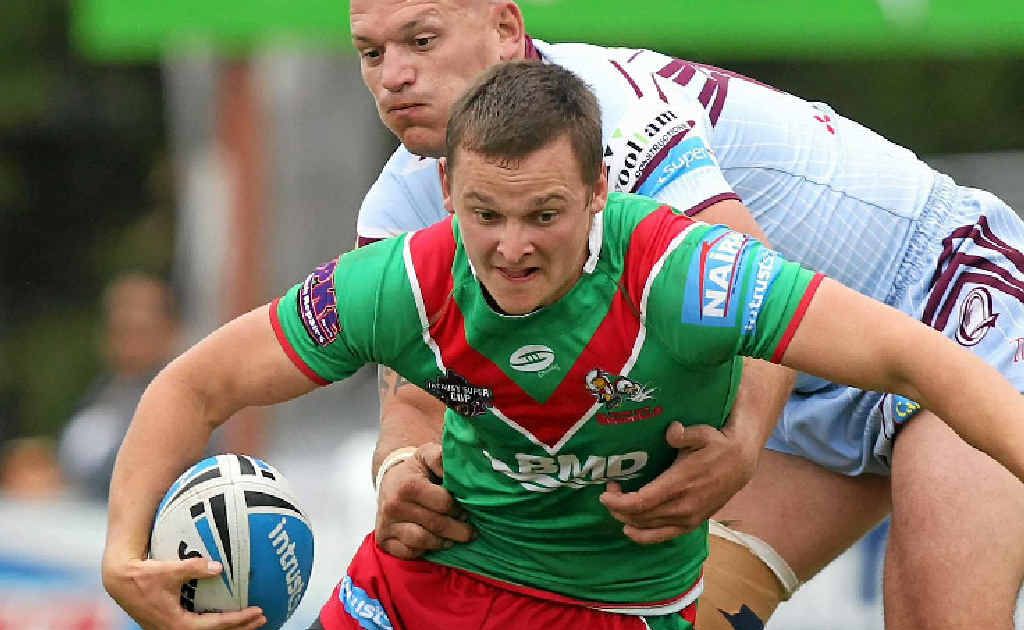 Wynnum’s Sean Loxley tries to break clear of the Central Capras defence. Wynnum’s Sean Loxley tries to break clear of the Central Capras defence.