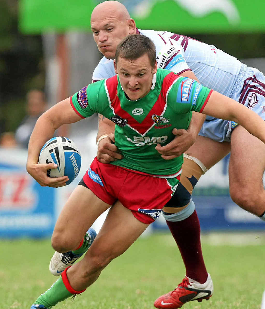 Wynnum’s Sean Loxley tries to break clear of the Central Capras defence. Wynnum’s Sean Loxley tries to break clear of the Central Capras defence.
