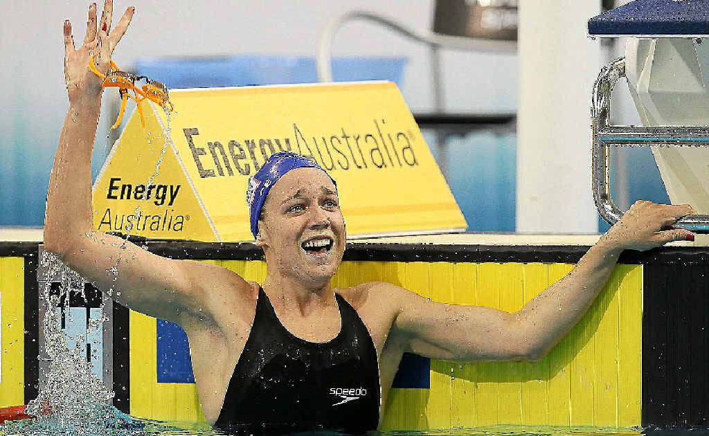 Tessa Wallace looks to her supporters in the crowd after winning last night’s 200m breaststroke final. Inset: Melanie Schlanger punches the air with delight after taking out the 100m freestyle final at the Olympic trials in Adelaide. Tessa Wallace looks to her supporters in the crowd after winning last night’s 200m breaststroke final. Inset: Melanie Schlanger punches the air with delight after taking out the 100m freestyle final at the Olympic trials in Adelaide.