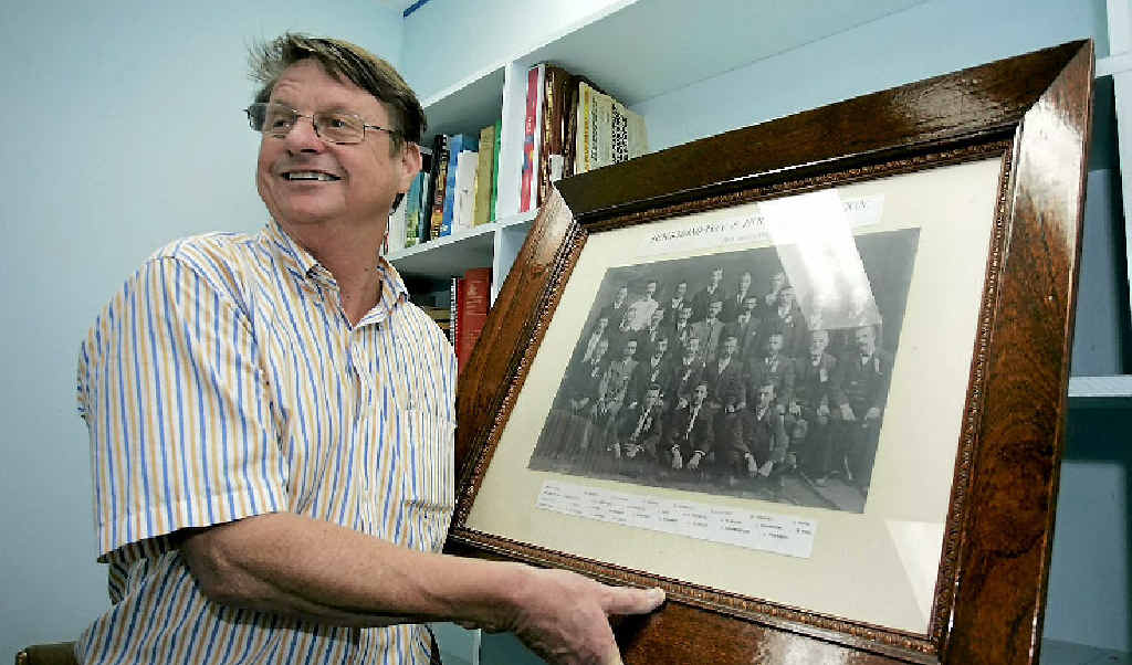 Robert Schwarten holds up a 1910 framed photograph, which features his great grandfather Johan, at his Denham St office. Robert Schwarten holds up a 1910 framed photograph, which features his great grandfather Johan, at his Denham St office.