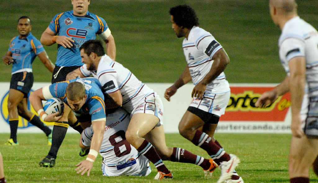 Cutters forwards Lewis Balcomb and Jason Schirnack take down the Norths Devils’ Jarrod Wallace. Cutters forwards Lewis Balcomb and Jason Schirnack take down the Norths Devils’ Jarrod Wallace.