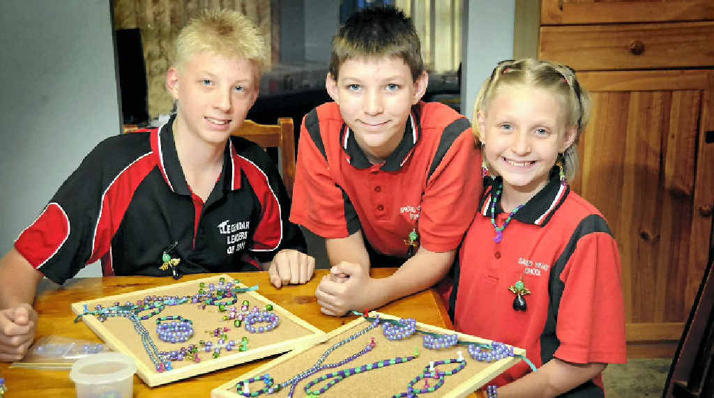 Dylan (from left), Curtis and Charlotte Barber with some of their colourful creations they will be selling today. They will send the money they raise to Epilepsy Queensland. Dylan (from left), Curtis and Charlotte Barber with some of their colourful creations they will be selling today. They will send the money they raise to Epilepsy Queensland.