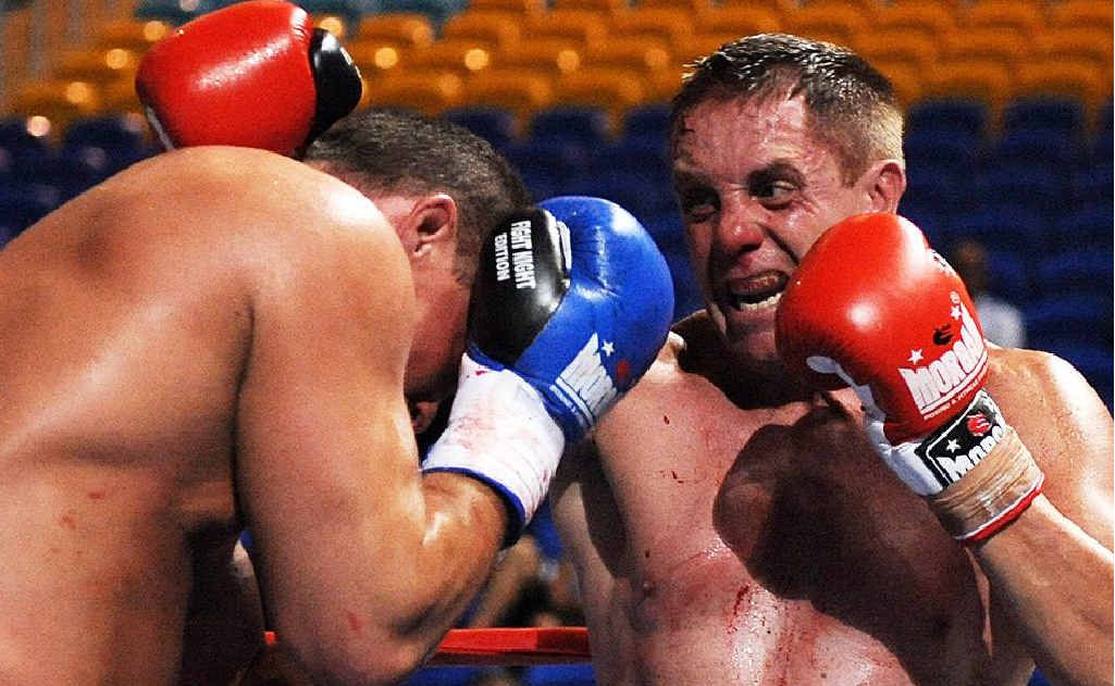 Robert Glasson-Wilesmith (right) keeps Mike Sheppard of the USA at bay during the IKF world heavyweight kickboxing title bout at Skilled Park on the Gold Coast. Robert Glasson-Wilesmith (right) keeps Mike Sheppard of the USA at bay during the IKF world heavyweight kickboxing title bout at Skilled Park on the Gold Coast.