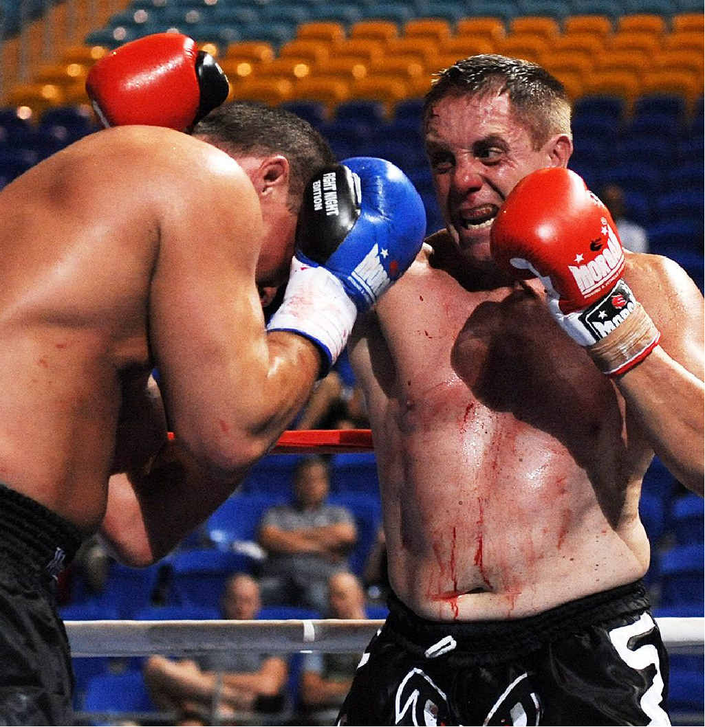 Robert Glasson-Wilesmith (right) keeps Mike Sheppard of the USA at bay during the IKF world heavyweight kickboxing title bout at Skilled Park on the Gold Coast. Robert Glasson-Wilesmith (right) keeps Mike Sheppard of the USA at bay during the IKF world heavyweight kickboxing title bout at Skilled Park on the Gold Coast.