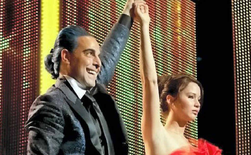 Stanley Tucci and Jennifer Lawrence in a scene from the movie The Hunger Games. Stanley Tucci and Jennifer Lawrence in a scene from the movie The Hunger Games.