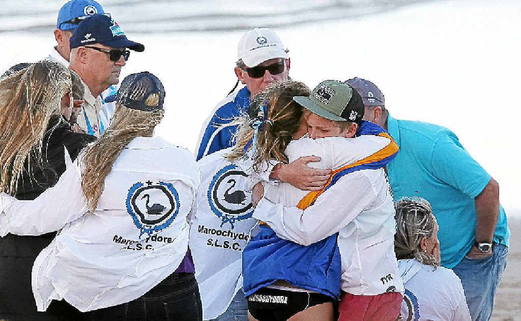 Maroochydore Surf Club members console each other during the search for Matt Barclay at Kurrawa. Maroochydore Surf Club members console each other during the search for Matt Barclay at Kurrawa.