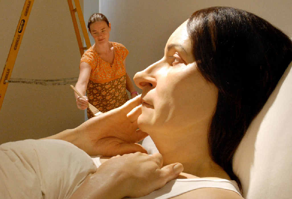 Queensland Art Gallery's modern art sculpture technician Danielle Hastie is overshadowed by the huge Ron Mueck sculpture 'In Bed'. Queensland Art Gallery's modern art sculpture technician Danielle Hastie is overshadowed by the huge Ron Mueck sculpture 'In Bed'.