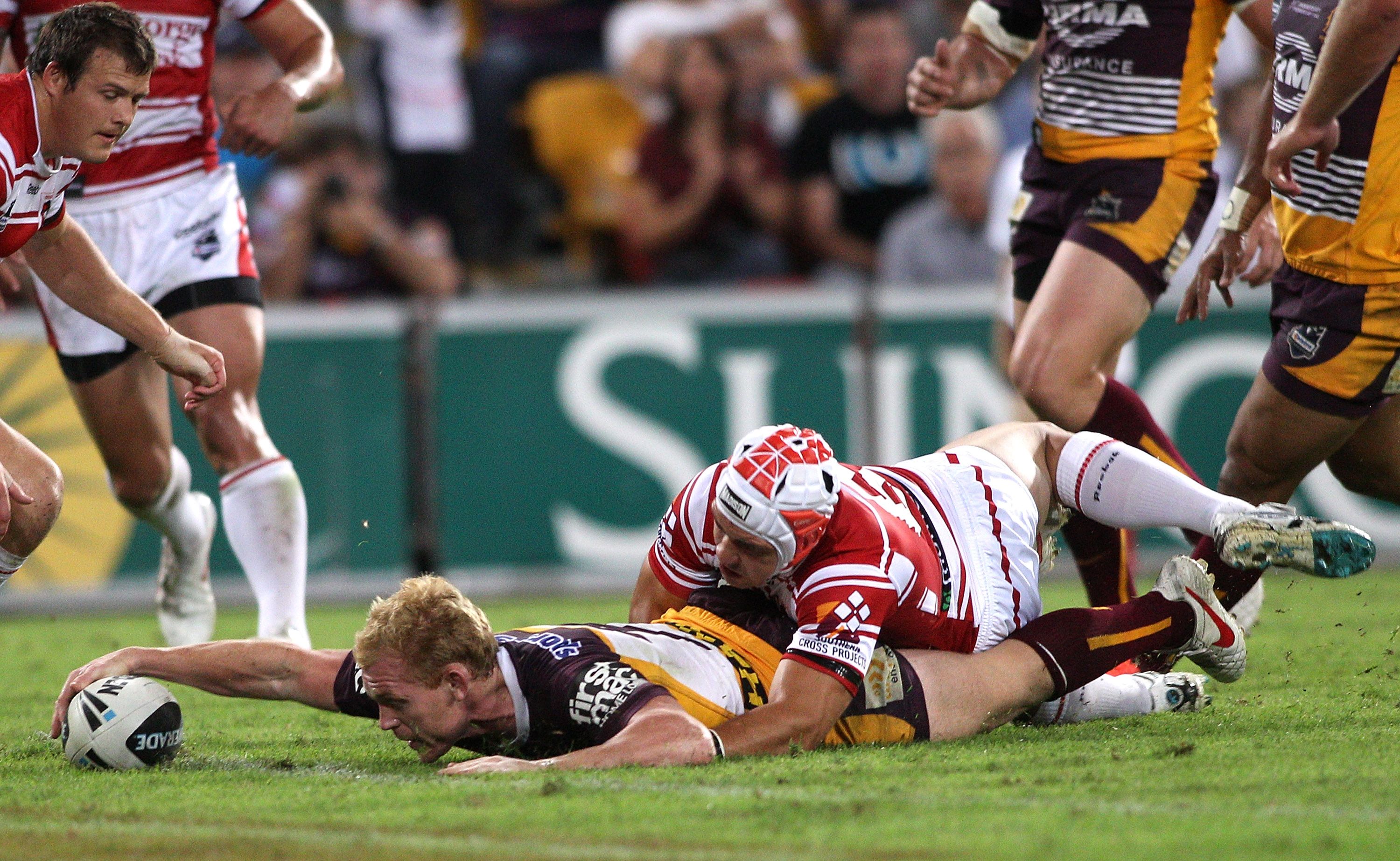 Peter Wallace of the Broncos scores a try during the round five NRL match between the Brisbane Broncos and the St George Illawarra Dragons at Suncorp Stadium Peter Wallace of the Broncos scores a try during the round five NRL match between the Brisbane Broncos and the St George Illawarra Dragons at Suncorp Stadium