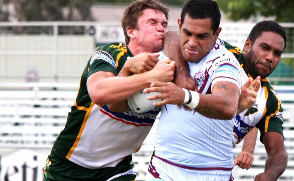 Ipswich Jets backs Jarrod McInally (left) and Donald Malone pull down Central Capras player Dan Randall in the Jets’ courageous 36-28 victory yesterday. Ipswich Jets backs Jarrod McInally (left) and Donald Malone pull down Central Capras player Dan Randall in the Jets’ courageous 36-28 victory yesterday.