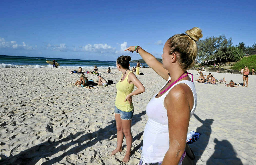 English tourists Frankie Jackson-Spence and Lisa Butler (pointing to the area where the men got into difficulties) witnessed the efforts of lifesavers to save three men. They saved one, but the other two died. English tourists Frankie Jackson-Spence and Lisa Butler (pointing to the area where the men got into difficulties) witnessed the efforts of lifesavers to save three men. They saved one, but the other two died.