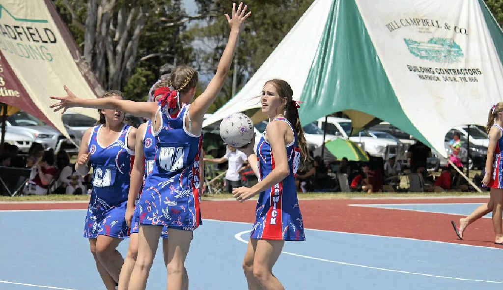 Warwick representative player Maddi Nott in possession in representative netball. Warwick representative player Maddi Nott in possession in representative netball.