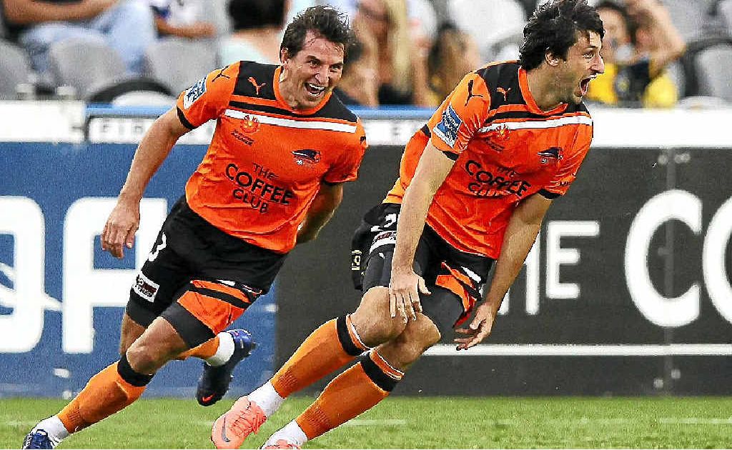 Roar midfielder Thomas Broich celebrates after scoring his team’s first goal. Roar midfielder Thomas Broich celebrates after scoring his team’s first goal.