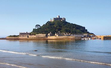 St Michael's Mount in Cornwall, originally a coastal hill, now lies nearly 400m offshore from the village of Marazion.
St Michael's Mount in Cornwall, originally a coastal hill, now lies nearly 400m offshore from the village of Marazion.