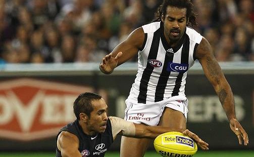 Eddie Betts of the Blues gathers the ball infront of Harry O'Brien of the Magpies during the round three AFL match.