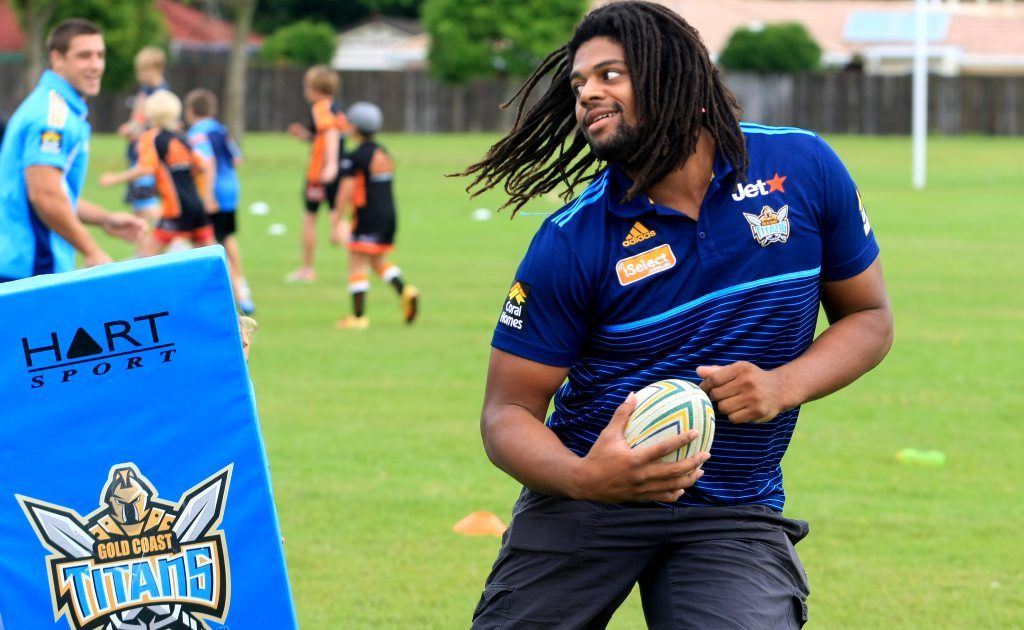 Jamal Idris is king of the kids at Banora Point High School during a Titans coaching clinic. Jamal Idris is king of the kids at Banora Point High School during a Titans coaching clinic.