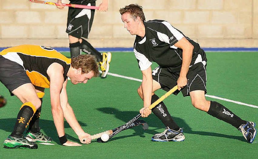 Easts defender Chris Mantell tries to stop dangerous Wests player Todd Watson during Saturday’s A-grade match at Raceview. Easts won 3-1. Easts defender Chris Mantell tries to stop dangerous Wests player Todd Watson during Saturday’s A-grade match at Raceview. Easts won 3-1.