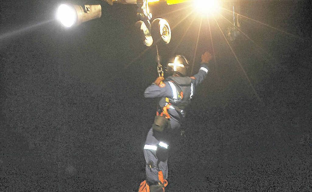 A paramedic during a night rescue operation at Lennox Head. A paramedic during a night rescue operation at Lennox Head.