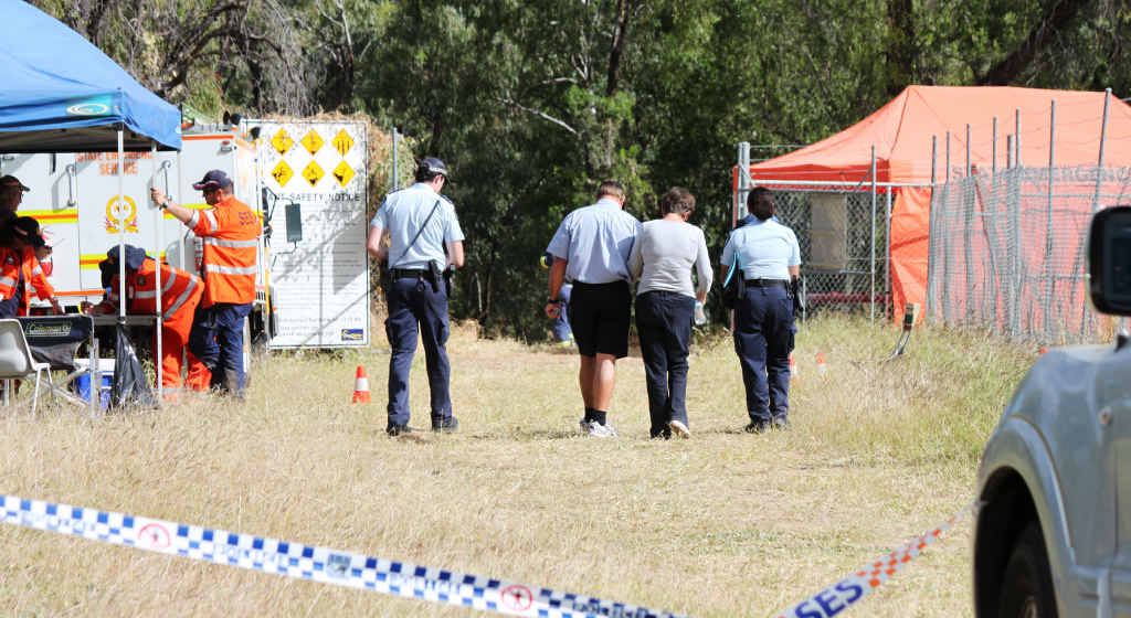 Relatives of missing kayaker Michael Barnes are escorted by Emerald police to the Selma Weir search site. Relatives of missing kayaker Michael Barnes are escorted by Emerald police to the Selma Weir search site.