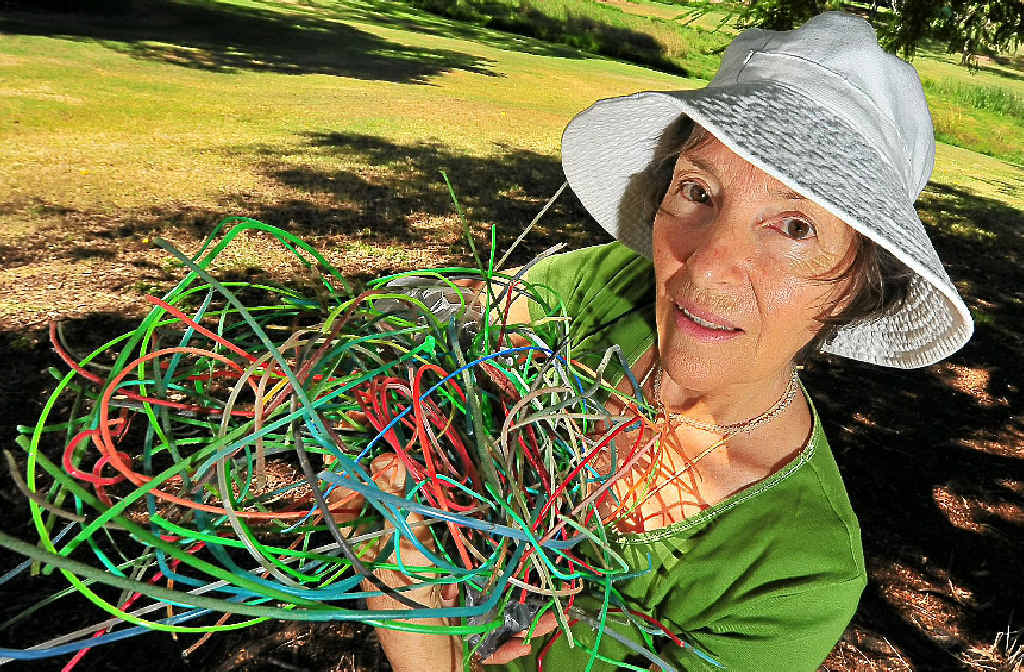 Suzanne Mason Winter with a handful of whipper snipper cord that she has collected on her morning walks.