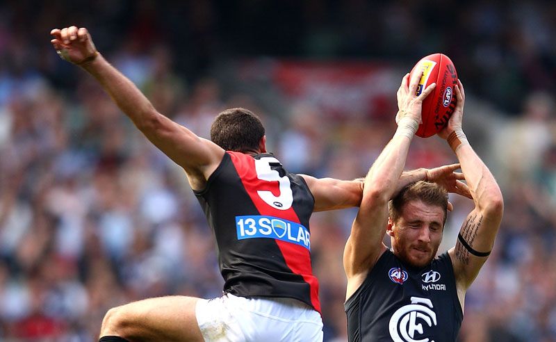 Zach Tuohy of the Blues marks under pressure from Brent Stanton of the Bombers during the round four AFL match between the Carlton Blues and the Essendon Bombers at Melbourne Cricket Ground Zach Tuohy of the Blues marks under pressure from Brent Stanton of the Bombers during the round four AFL match between the Carlton Blues and the Essendon Bombers at Melbourne Cricket Ground