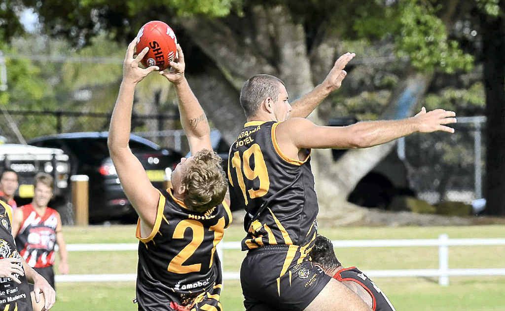 Tigers’ Ryan Sheather marks the ball against the Saints at Ellem Oval on Saturday. Tigers’ Ryan Sheather marks the ball against the Saints at Ellem Oval on Saturday.