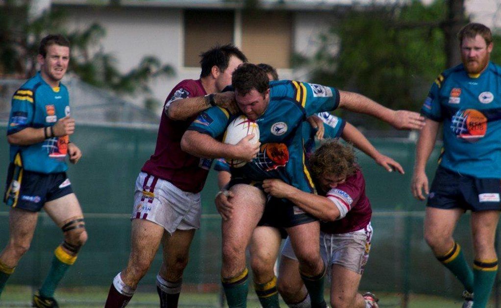 Alan Campbell of the Evans Head Bombers takiong two opposition tacklers with him on a strong run. Photo Contributed Alan Campbell of the Evans Head Bombers takiong two opposition tacklers with him on a strong run. Photo Contributed