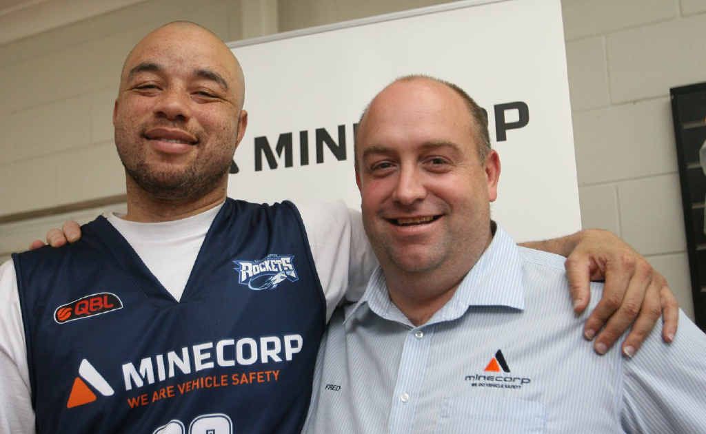 Rockets star Travis Reed with Minecorp general manager Fred Goodwin. Rockets star Travis Reed with Minecorp general manager Fred Goodwin.