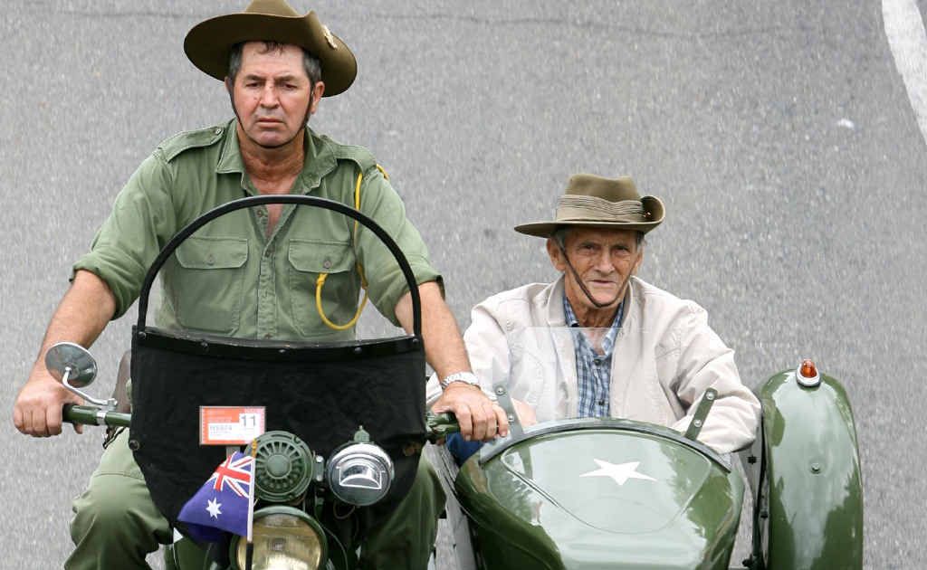 Andy Wright takes World War II digger Laurie Fraser for a ride during the Anzac Day parade on Quay St in Rockhampton yesterday. Andy Wright takes World War II digger Laurie Fraser for a ride during the Anzac Day parade on Quay St in Rockhampton yesterday.