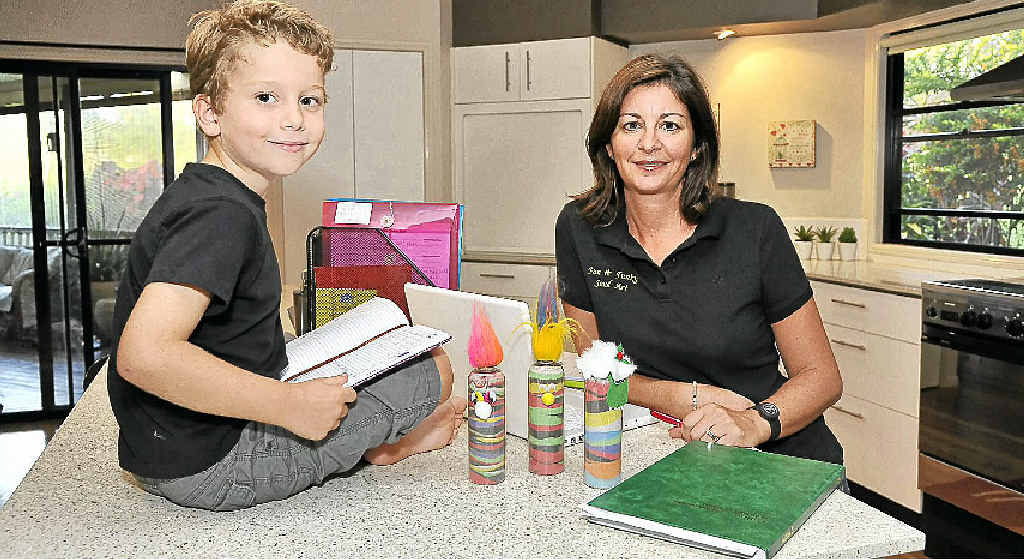 TOP TEAM: Jayne Lawlor, with the help of her son Joshua, 5, is running her business Fun and Funky Sand Art from home. TOP TEAM: Jayne Lawlor, with the help of her son Joshua, 5, is running her business Fun and Funky Sand Art from home.