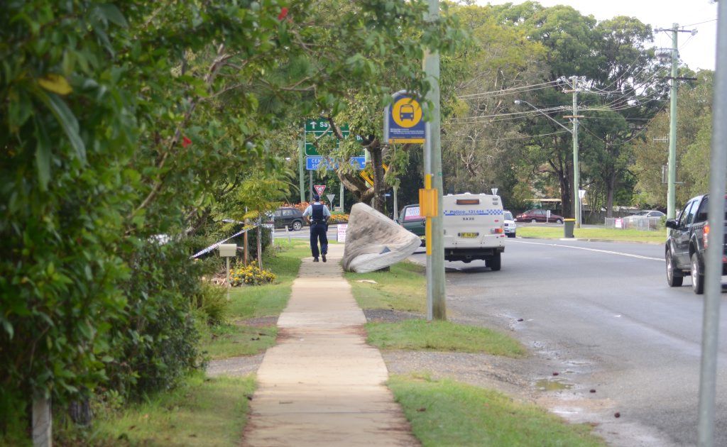 Police keep the public away from the Toormina residence of a woman allegedly murdered yesterday.
Police keep the public away from the Toormina residence of a woman allegedly murdered yesterday.