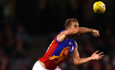 Joel Patfull of the Lions handballs during the round six AFL match between the Essendon Bombers and the Brisbane Lions at Etihad Stadium Joel Patfull of the Lions handballs during the round six AFL match between the Essendon Bombers and the Brisbane Lions at Etihad Stadium