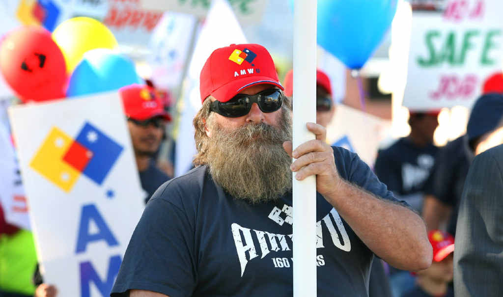 AMWU organiser Peter Lyon carries a banner during yesterday’s Labour Day march in Rockhampton. AMWU organiser Peter Lyon carries a banner during yesterday’s Labour Day march in Rockhampton.