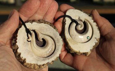 Fishhook and koru bone carvings produced by Jim and Chris Eagles at Pacific Carvers.
Fishhook and koru bone carvings produced by Jim and Chris Eagles at Pacific Carvers.