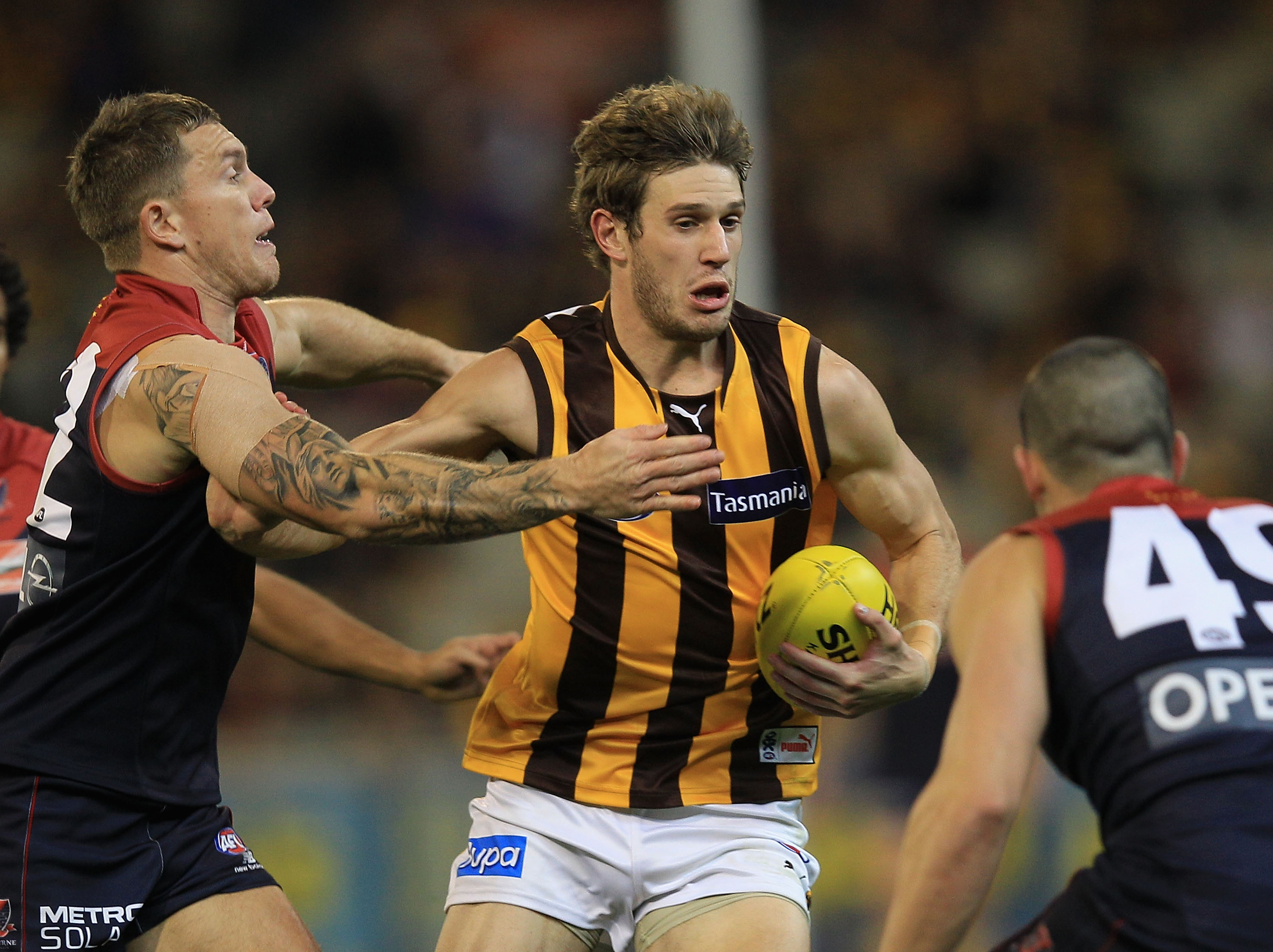 Grant Birchall of the Hawks in action during the round seven AFL match between the Melbourne Demons and the Hawthorn Hawks at the Melbourne Cricket Ground Grant Birchall of the Hawks in action during the round seven AFL match between the Melbourne Demons and the Hawthorn Hawks at the Melbourne Cricket Ground
