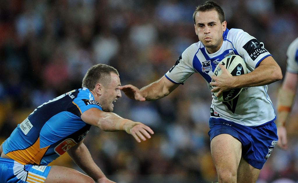 Josh Reynolds of the Bulldogs runs the ball in attack during the round 10 NRL match between the Canterbury Bulldogs and the Gold Coast Titans at Suncorp Stadium Josh Reynolds of the Bulldogs runs the ball in attack during the round 10 NRL match between the Canterbury Bulldogs and the Gold Coast Titans at Suncorp Stadium