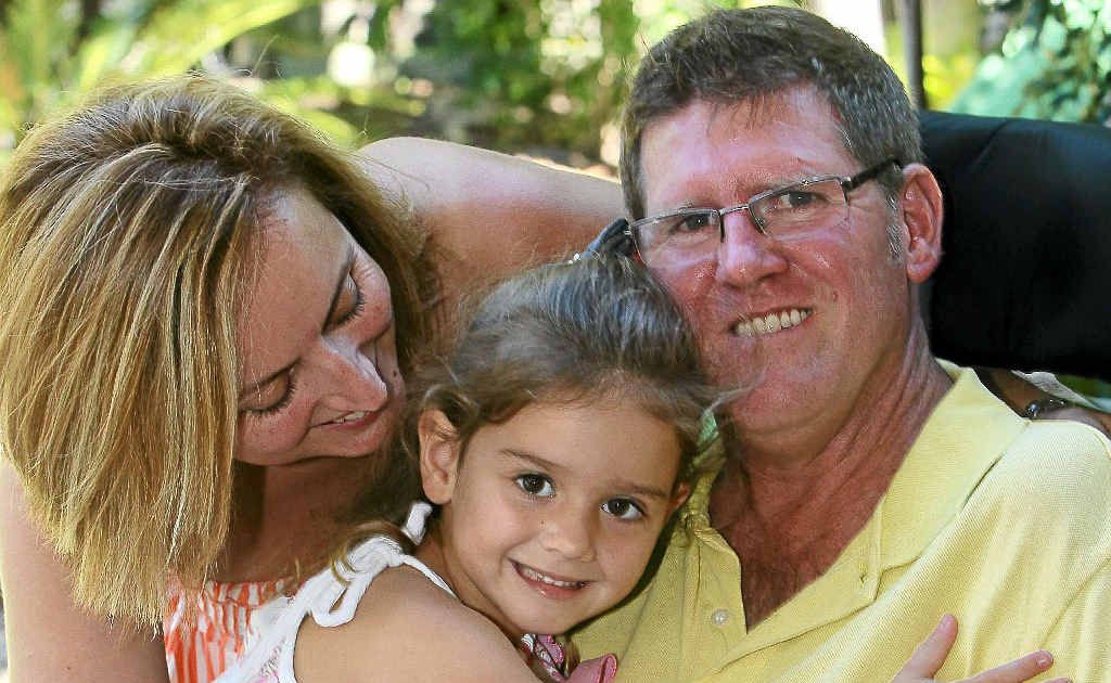 Kelly and Mark Rowlinson with their third child, four-year-old Mia. Mark was diagnosed with motor neurone disease six years ago. Kelly and Mark Rowlinson with their third child, four-year-old Mia. Mark was diagnosed with motor neurone disease six years ago.