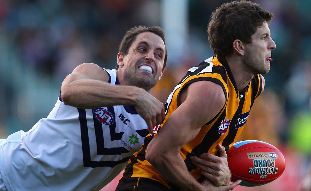 Luke Breust of the Hawks is tackled during the round eight AFL match between the Hawthorn Hawks and the Fremantle Dockers at Aurora Stadium Luke Breust of the Hawks is tackled during the round eight AFL match between the Hawthorn Hawks and the Fremantle Dockers at Aurora Stadium