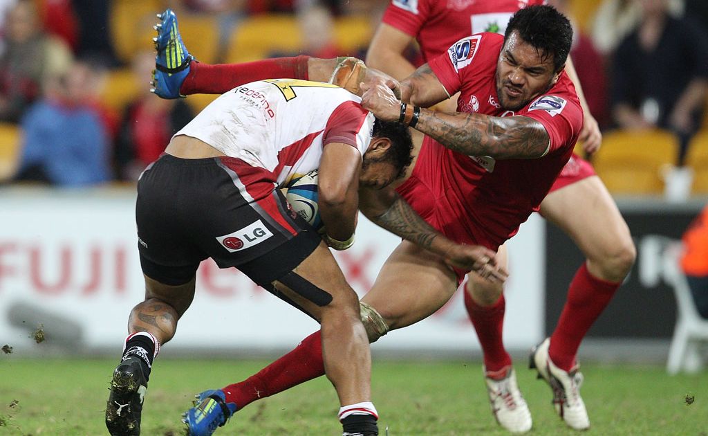 James Kamana of the Lions is tackled by Digby Ioane of the Reds during the round 13 Super Rugby match between the Reds and the Lions at Suncorp Stadium. James Kamana of the Lions is tackled by Digby Ioane of the Reds during the round 13 Super Rugby match between the Reds and the Lions at Suncorp Stadium.