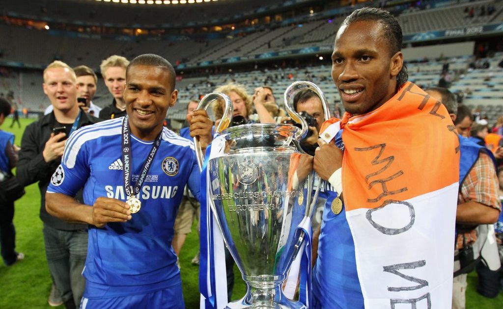 Didier Drogba (right) and Florent Malouda of Chelsea celebrate with the trophy after their victory in the UEFA Champions League Final between FC Bayern Muenchen and Chelsea at the Fussball Arena Munchen on May 19, 2012 in Munich, Germany. Didier Drogba (right) and Florent Malouda of Chelsea celebrate with the trophy after their victory in the UEFA Champions League Final between FC Bayern Muenchen and Chelsea at the Fussball Arena Munchen on May 19, 2012 in Munich, Germany.