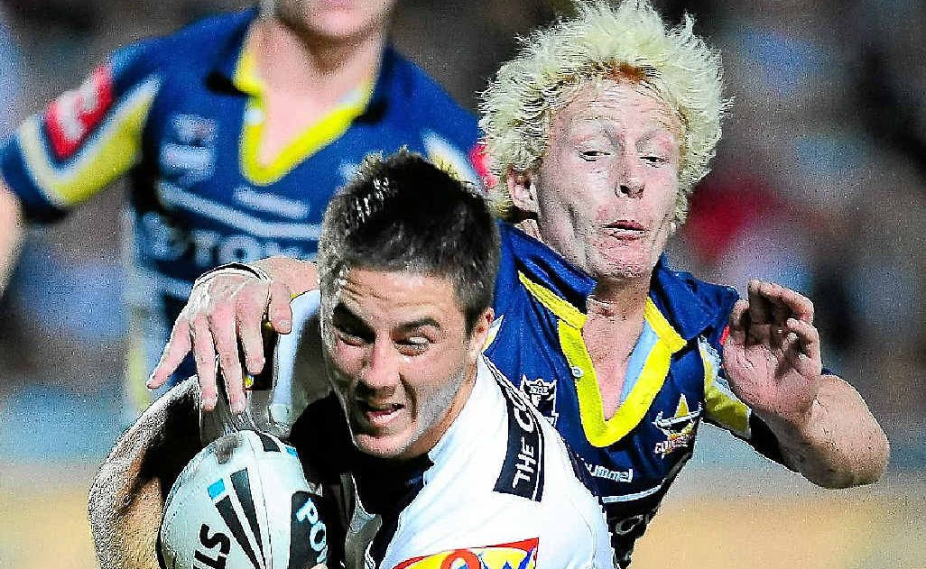 Ben Hunt of the Broncos is tackled by Dane Hogan. Ben Hunt of the Broncos is tackled by Dane Hogan.